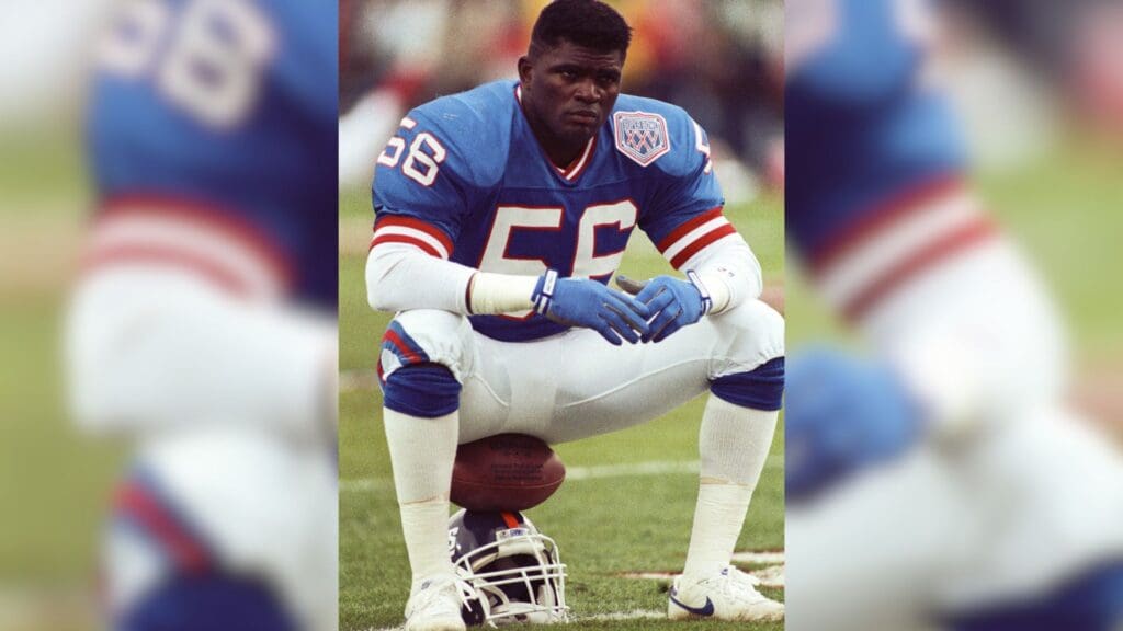 Jan 27, 1991; Tampa, FL, USA; FILE PHOTO; New York Giants linebacker Lawrence Taylor (56) sits on his helmet prior to the start of Super Bowl XXV against the Buffalo Bills at Tampa Stadium. The Giants defeated the Bills 19-20.