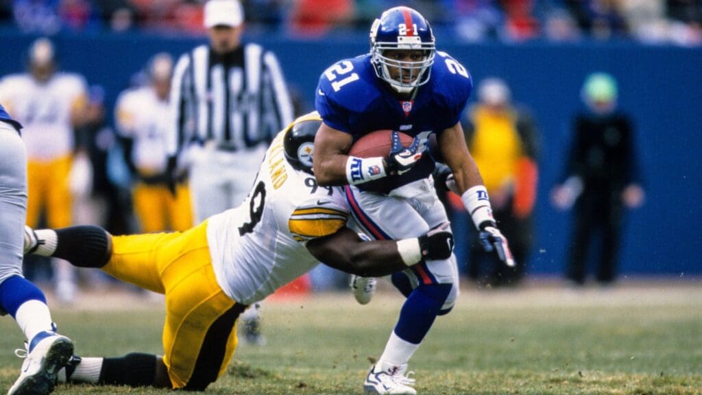 Dec 10, 2000; East Rutherford, NJ, USA; FILE PHOTO; New York Giants running back Tiki Barber (21) in action against Pittsburgh Steelers linebacker Levon Kirkland (99) at Giants Stadium.