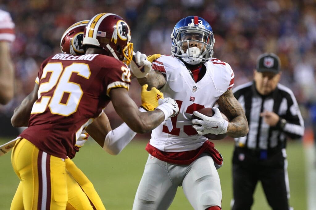 Jan 1, 2017; Landover, MD, USA; New York Giants wide receiver Odell Beckham Jr. (13) runs with the ball as Washington Redskins cornerback Josh Norman (24) and Redskins cornerback Bashaud Breeland (26) chase in the second quarter at FedEx Field.