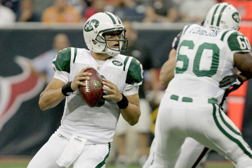August 15, 2011; Houston, TX, USA; New York Jets quarterback Mark Sanchez looks for an open receiver in the first quarter against the Houston Texans at Reliant Stadium.