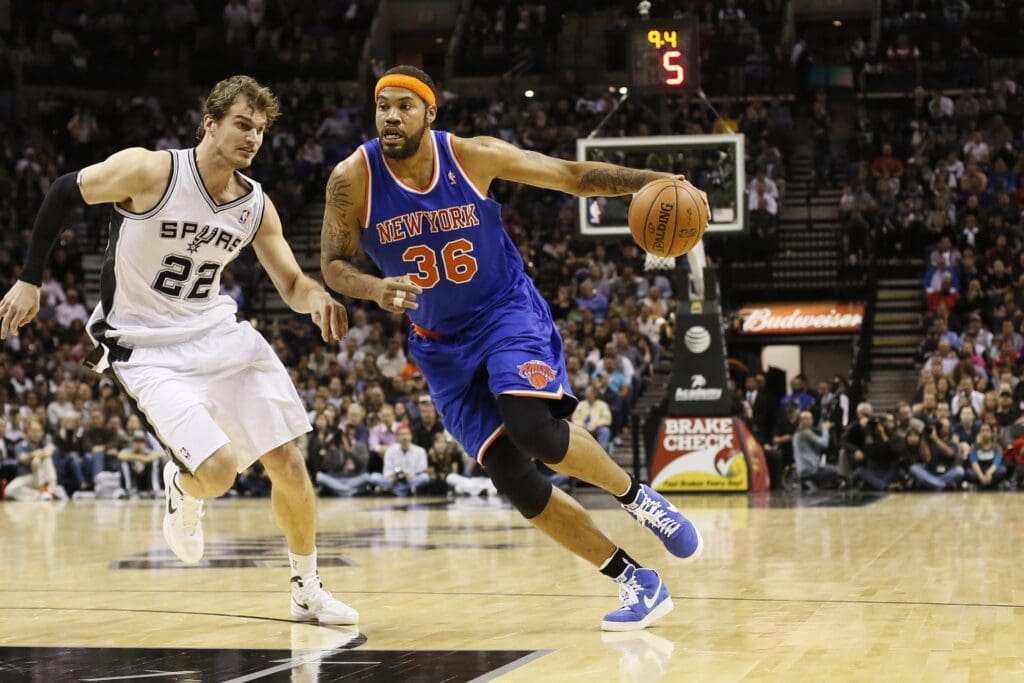Nov 15, 2012; San Antonio, TX, USA; New York Knicks forward Rasheed Wallace (36) drives to the basket as San Antonio Spurs forward Tiago Splitter (22) defends during the second half at the AT&T Center. The Knicks won 104-100.