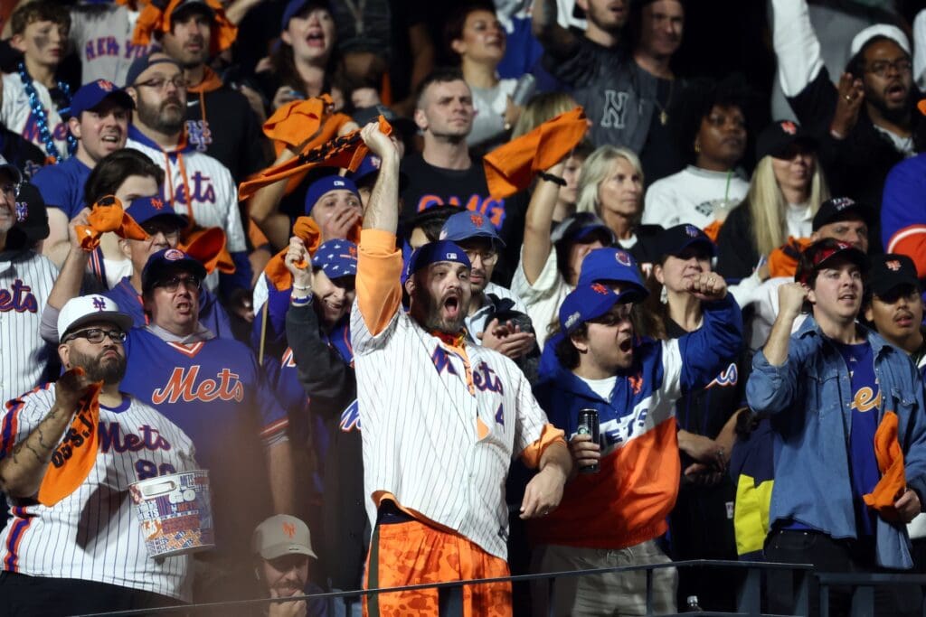 Oct 8, 2024; New York City, New York, USA; New York Mets fans cheer in the seventh inning against the Philadelphia Phillies during game three of the NLDS for the 2024 MLB Playoffs at Citi Field.