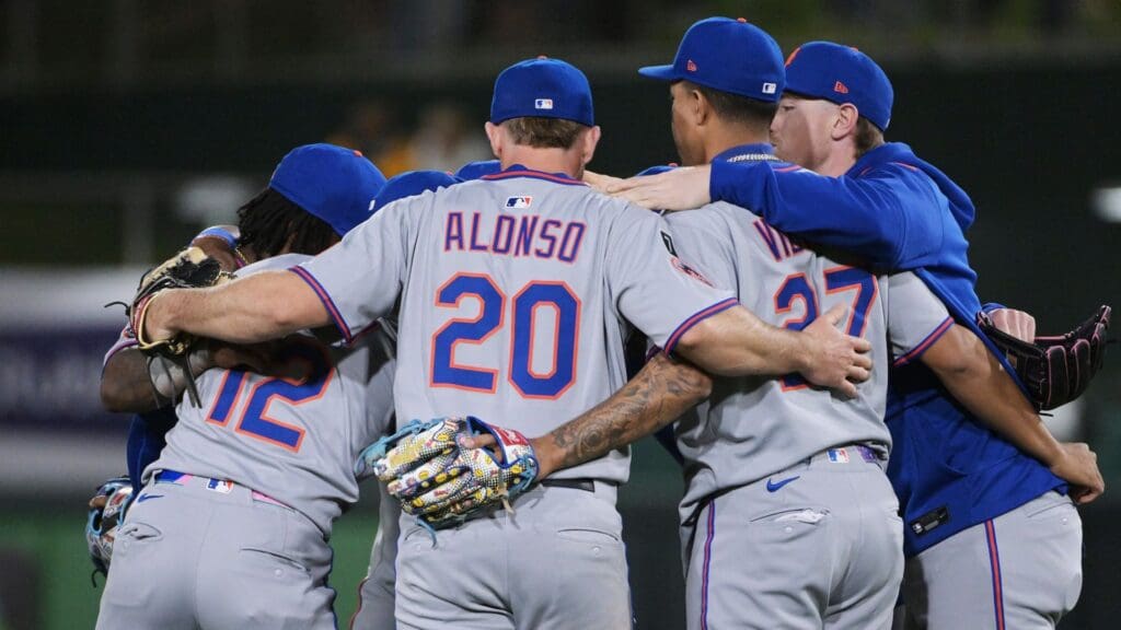Apr 11, 2025; West Sacramento, California, USA; New York Mets shortstop Francisco Lindor (12) and first base Pete Alonso (20) and third base Mark Vientos (27) embrace team mates after defeating the Athletics at Sutter Health Park.