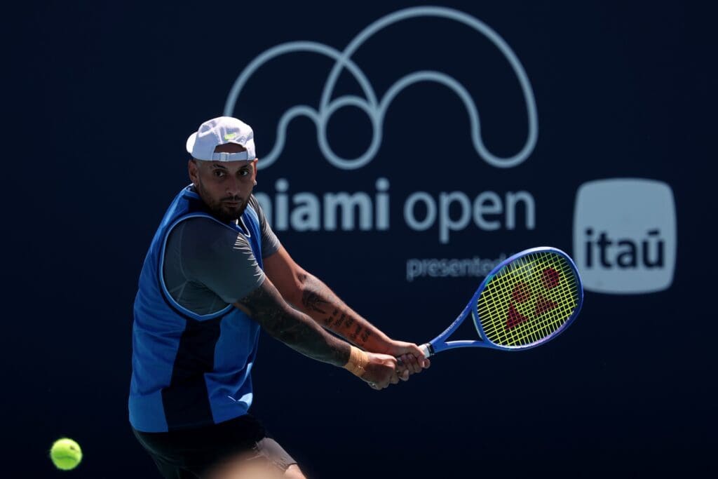Mar 21, 2025; Miami, FL, USA; Nick Kyrgios (AUS) hits a backhand against Karen Khachanov (not pictured) on day four of the Miami Open at Hard Rock Stadium.