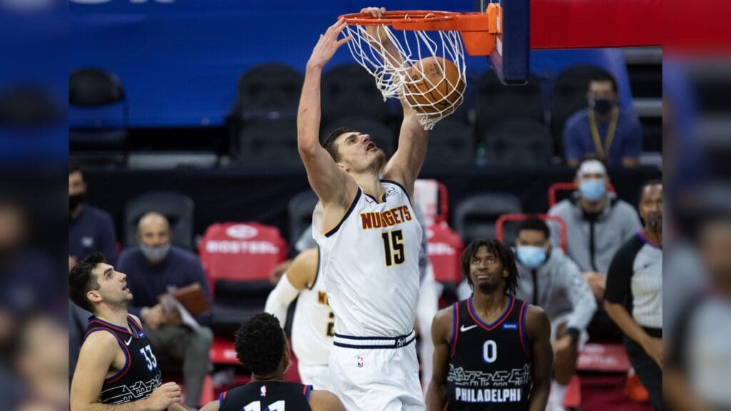 Jan 9, 2021; Philadelphia, Pennsylvania, USA; Denver Nuggets center Nikola Jokic (15) dunks the ball against the Philadelphia 76ers during the second quarter at Wells Fargo Center.