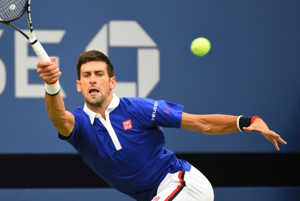 Sep 11, 2015; New York, NY, USA; Novak Djokovic of Serbia hits to Marin Cilic of Croatia on day twelve of the 2015 U.S. Open tennis tournament at USTA Billie Jean King National Tennis Center.