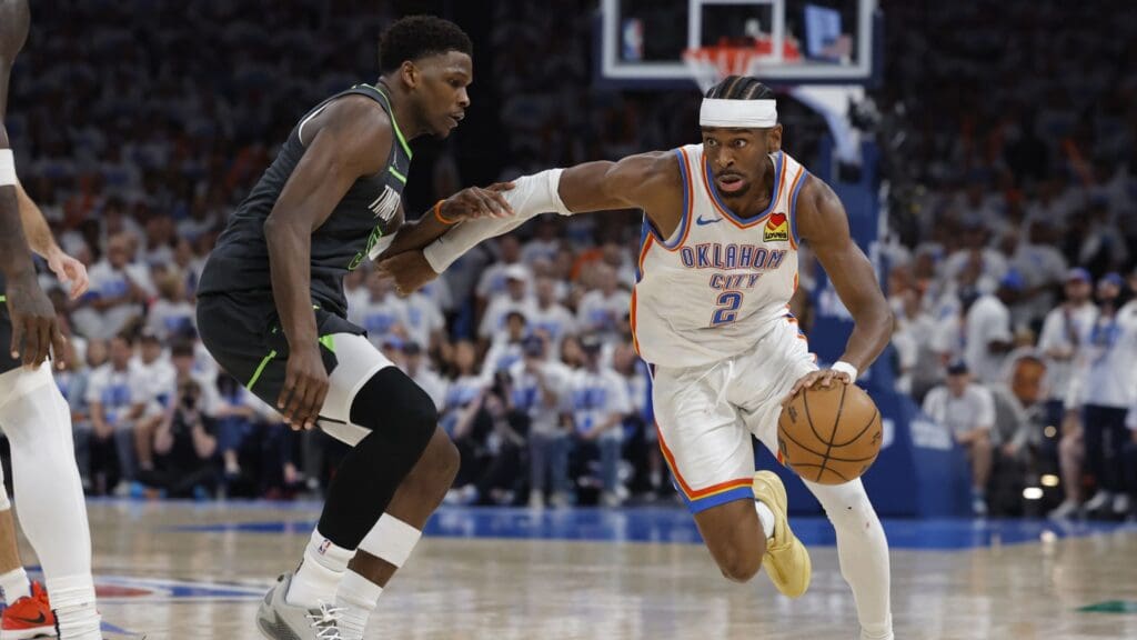 May 20, 2025; Oklahoma City, Oklahoma, USA; Oklahoma City Thunder guard Shai Gilgeous-Alexander (2) drives against Minnesota Timberwolves guard Anthony Edwards (5) in the fourth quarter during game one of the western conference finals for the 2025 NBA Playoffs at Paycom Center