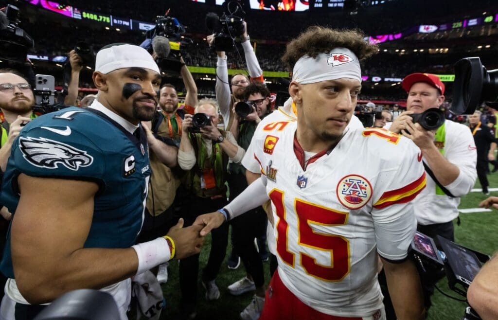 Feb 9, 2025; New Orleans, LA, USA; Philadelphia Eagles quarterback Jalen Hurts (1) greets Kansas City Chiefs quarterback Patrick Mahomes (15) following Super Bowl LIX at Ceasars Superdome.