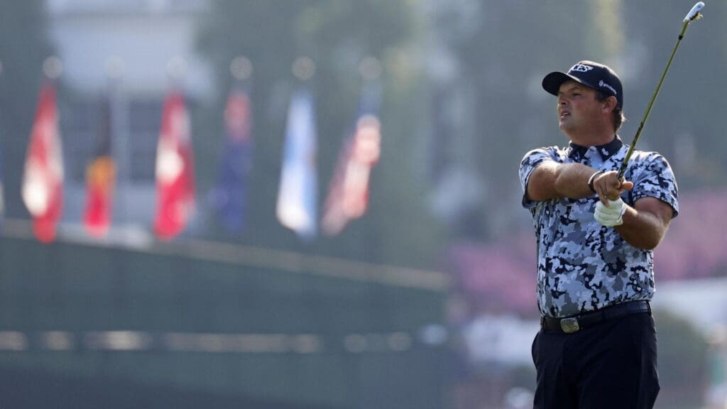 Apr 10, 2025; Augusta, Georgia, USA; Patrick Reed plays his shot from the first tee during the first round of the Masters Tournament.
