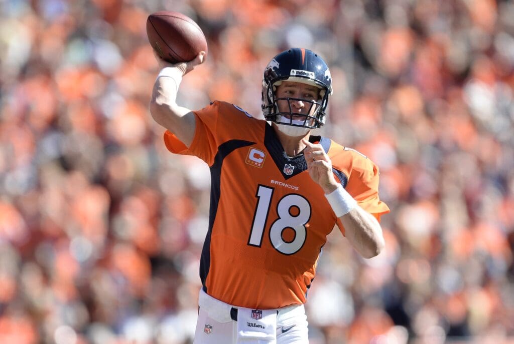 Oct 27, 2013; Denver, CO, USA; Denver Broncos quarterback Peyton Manning (18) prepares to pass in the first quarter against the Washington Redskins at Sports Authority Field at Mile High.