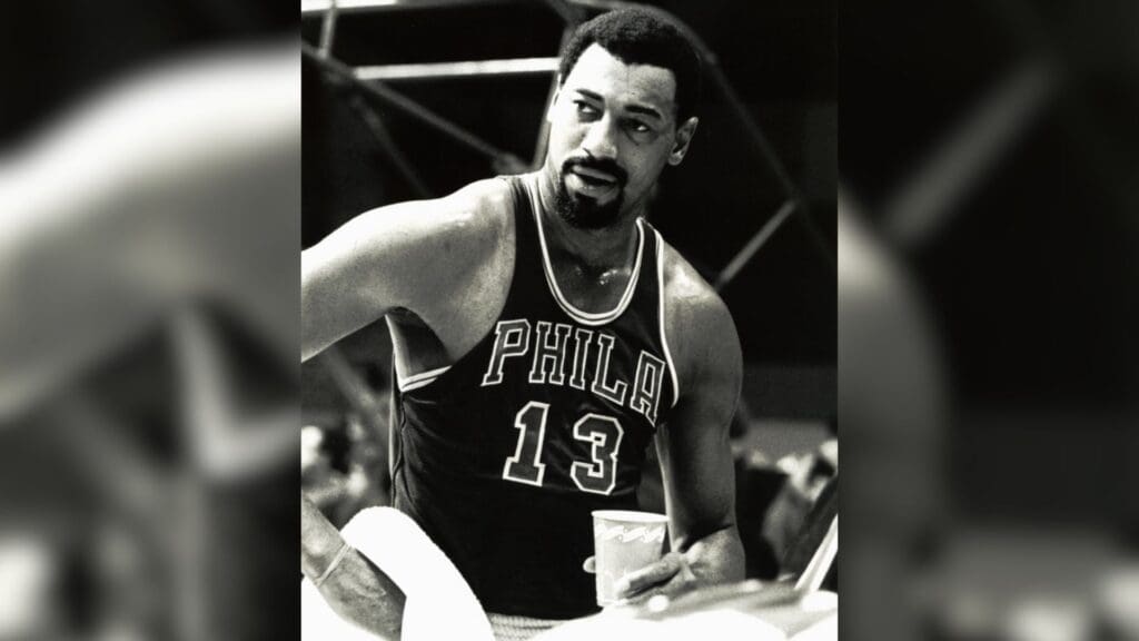 Unknown date and location; Philadelphia 76ers center Wilt Chamberlain (13) during a timeout. Chamberlain scored 31,419 points, averaging 30.1 ppg, during 1,045 games over a 16-year Hall of Fame career. Chamberlain led the NBA in scoring seven straight years, averaged 50.4 points per game in 1962 and scored a record 100 points in a single game on March 2, 1962 against the New York Knicks in Hershey, Pennsylvania.