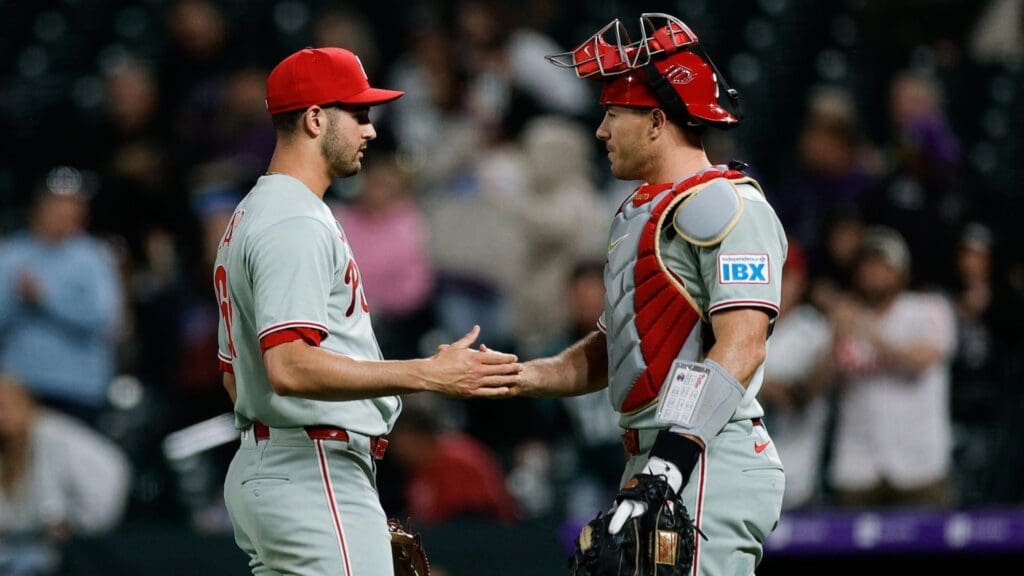 May 20, 2025; Denver, Colorado, USA; Philadelphia Phillies relief pitcher Max Lazar (60) and catcher J.T. Realmuto (10) celebrate after the game against the Colorado Rockies at Coors Field.