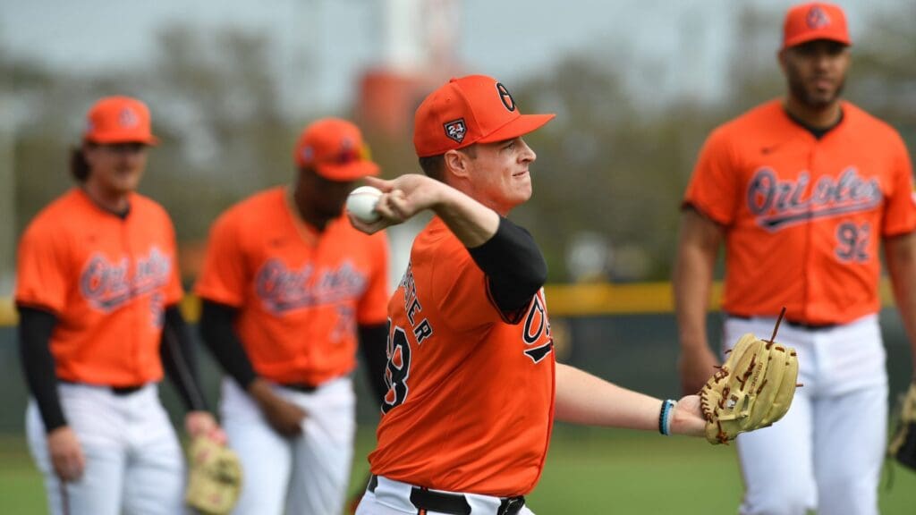 Pitcher Justin Armbruster (#98) a non-roster invitee, throws to first base during practice Thursday. The Baltimore Orioles started spring training on Thursday, Feb.15th with the first workout for pitchers and catchers at Ed Smith Stadium in Sarasota, Florida. Position players report next week with the first full squad workout on Tuesday, February 20th.