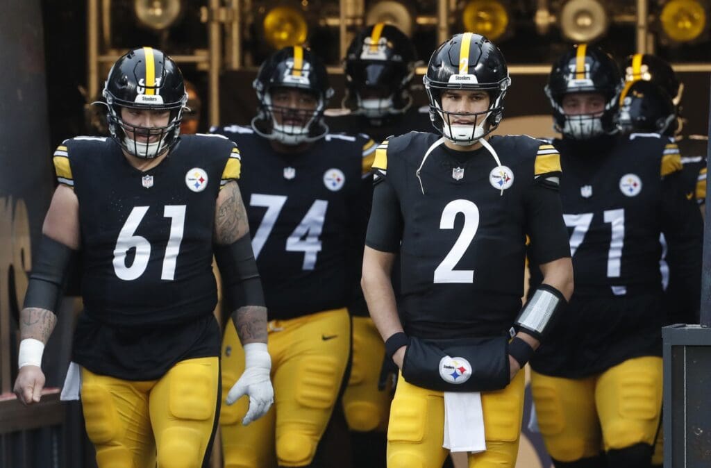 Dec 23, 2023; Pittsburgh, Pennsylvania, USA; Pittsburgh Steelers center Mason Cole (61) and quarterback Mason Rudolph (2) lead the offense onto the field to warm up before the game against the Cincinnati Bengals at Acrisure Stadium