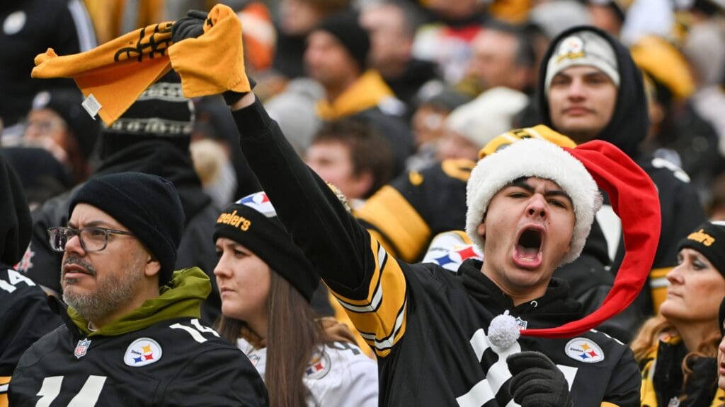 Dec 25, 2024; Pittsburgh, Pennsylvania, USA; A Pittsburgh Steelers fans cheers against the Kansas City Chiefs during the first quarter at Acrisure Stadium.