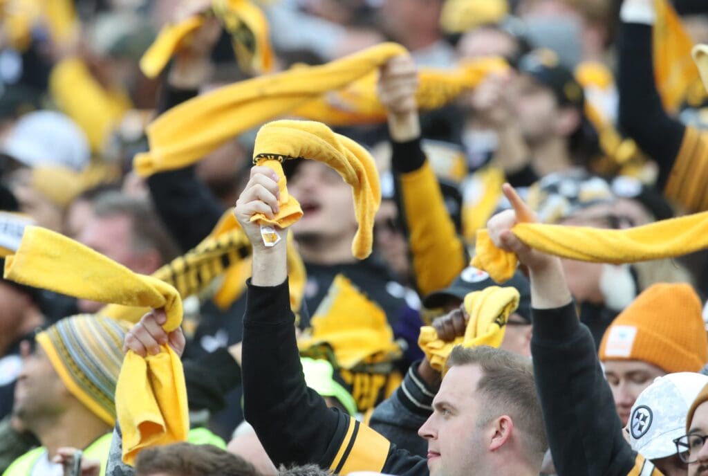 Pittsburgh Steelers fans wave Terrible Towels against the Baltimore Ravens during the fourth quarter at Acrisure Stadium.