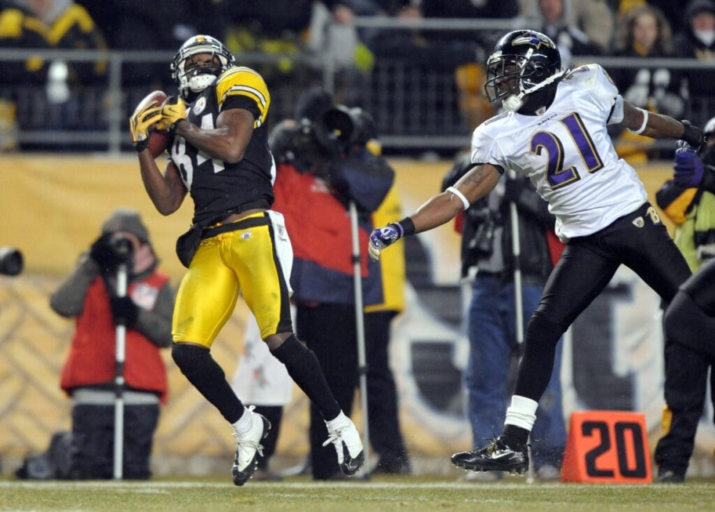 Pittsburgh Steelers receiver Antonio Brown (84) makes a 58-yard reception in the fourth quarter as Baltimore Ravens cornerback Laradrius Webb (21) defends during the 2011 AFC Divisional playoff game at Heinz Field. The Steelers defeated the Ravens 31-24. 