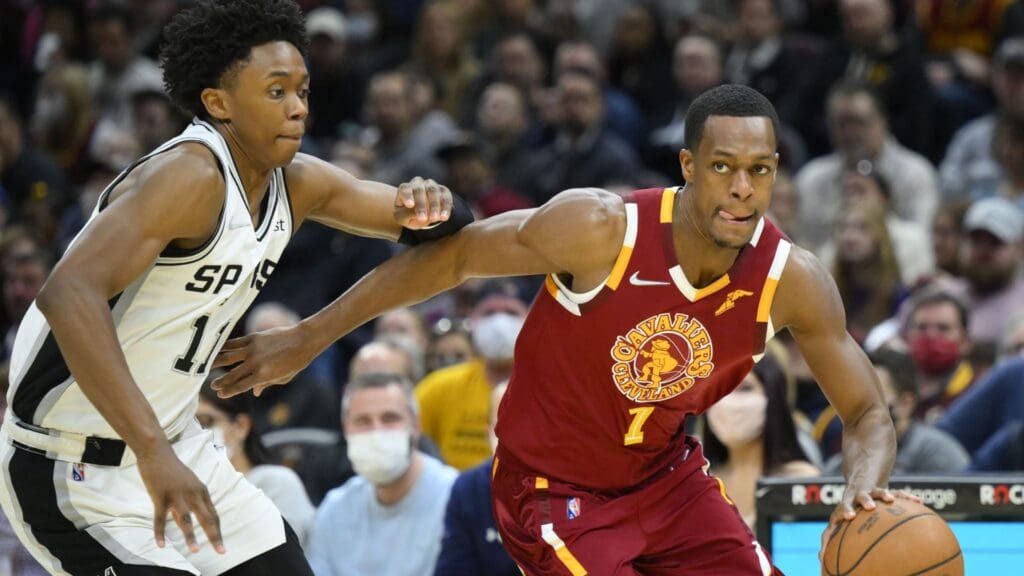 Feb 9, 2022; Cleveland, Ohio, USA; Cleveland Cavaliers guard Rajon Rondo (1) drives against San Antonio Spurs guard Joshua Primo (11) in the third quarter at Rocket Mortgage FieldHouse. Mandatory Credit: David Richard-Imagn Images