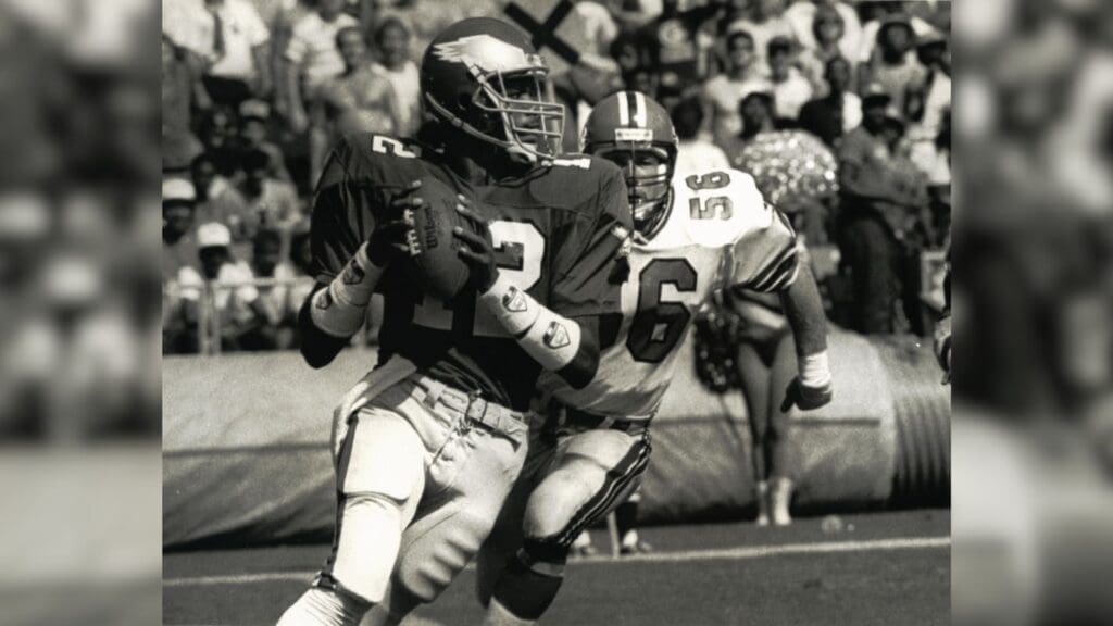 Oct. 5, 1986; Atlanta, GA, USA; FILE PHOTO; Philadelphia Eagles quarterback Randall Cunningham (12) scrambles against Atlanta Falcons linebacker Joe Costello (56) at Atlanta-Fulton County Stadium.