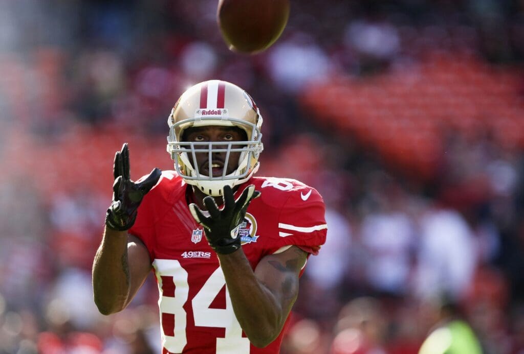 Dec 9, 2012; San Francisco, CA, USA; San Francisco 49ers wide receiver Randy Moss (84) catches a pass before the game against the Miami Dolphins at Candlestick Park.