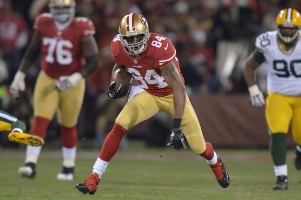 Jan 12, 2013; San Francisco, CA, USA; San Francisco 49ers wide receiver Randy Moss (84) runs the ball against the Green Bay Packers during the first quarter of the NFC divisional round playoff game at Candlestick Park.