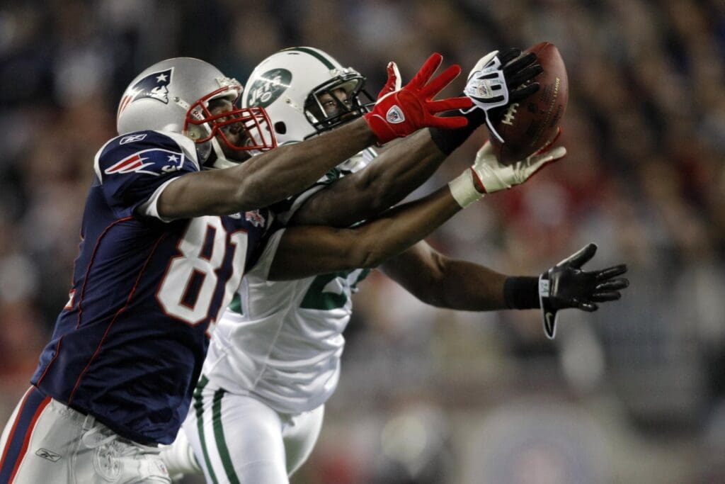 New York Jets cornerback Darrelle Revis (24) blocks the pass from New England Patriots wide receiver Randy Moss (81)during the first quarter at Gillette Stadium.
