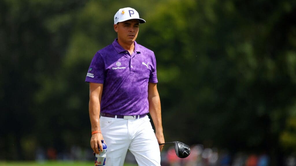 Sep 22, 2018; Atlanta, GA, USA; Rickie Fowler walks to the tee on the fourth hole during with a Red Bull drink the third round of the Tour Championship golf tournament at East Lake Golf Club.