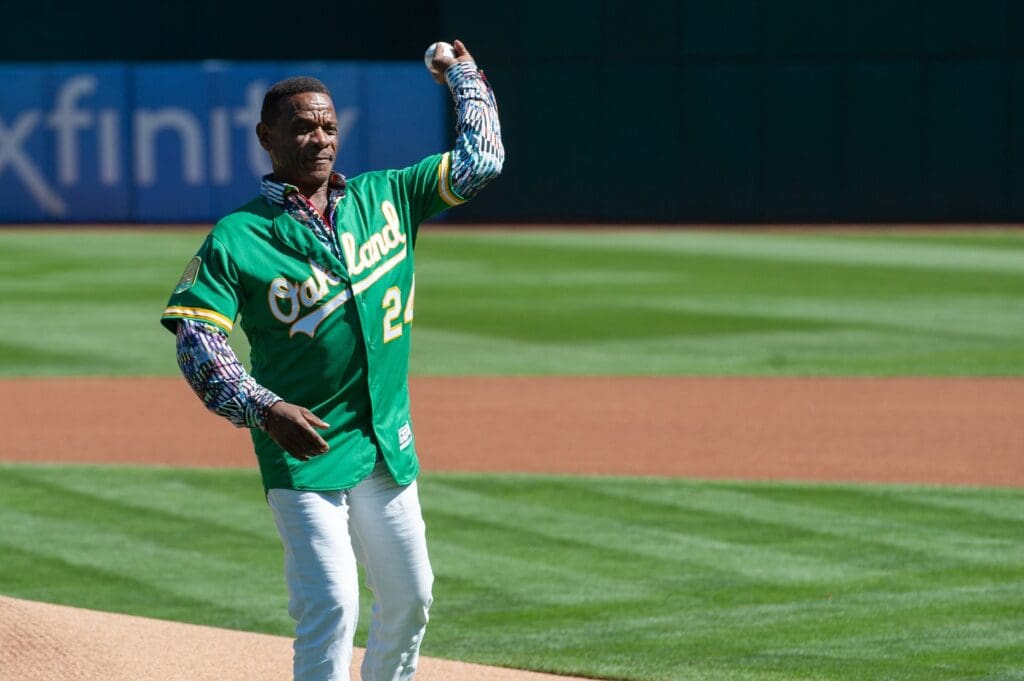 Sep 26, 2024; Oakland, California, USA; Oakland Athletics former outfielder Ricky Henderson throws out the first pitch before the game against the Texas Rangers at Oakland-Alameda County Coliseum.