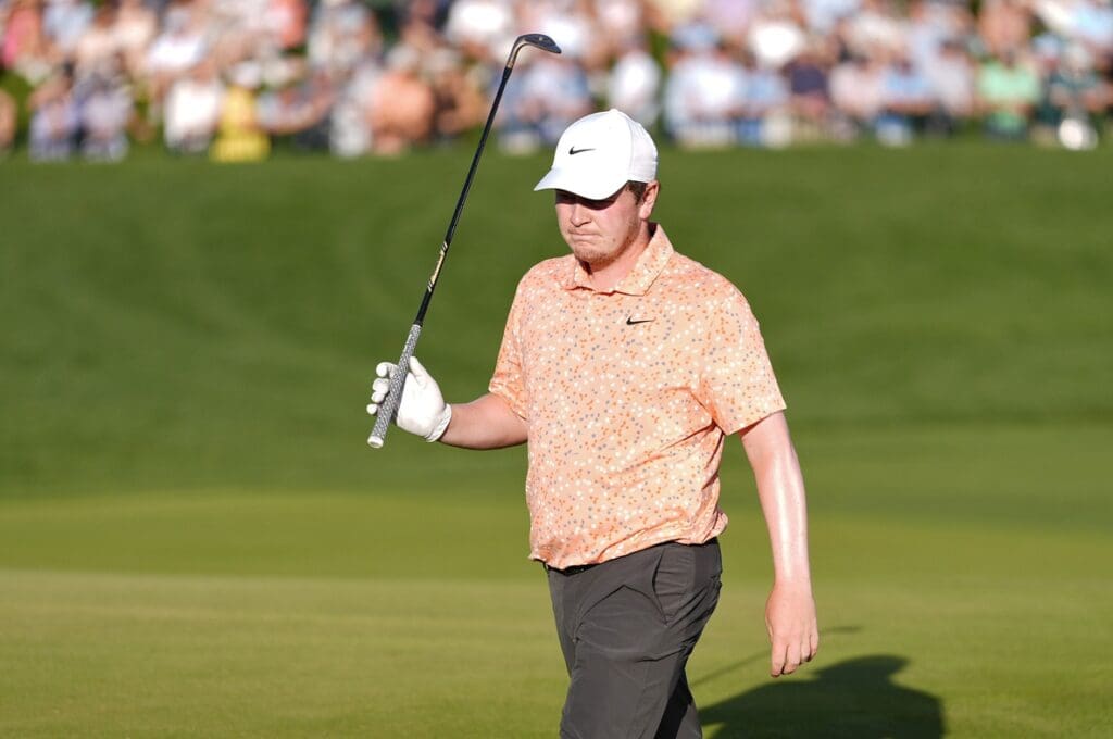 May 17, 2025; Charlotte, North Carolina, USA; Robert MacIntyre reacts after his shot following a drop after his ball went into the water on the 18th hole during the third round of the PGA Championship golf tournament at Quail Hollow.