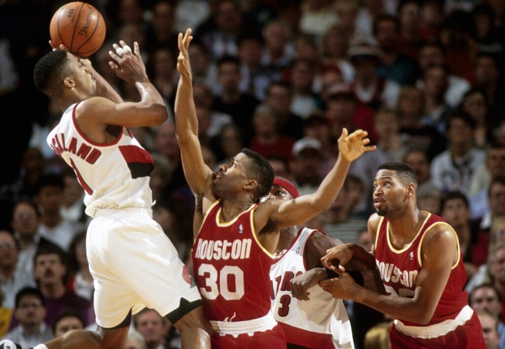 FILE PHOTO; Houston Rockets guard Kenny Smith (30) defends a shot by Portland Trail Blazers guard Rod Strickland (1) in the 1993-94 NBA Playoffs at Memorial Coliseum.