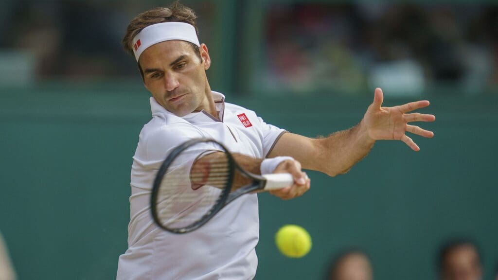 Jul 14, 2019; London, United Kingdom; Roger Federer (SUI) in action during the mens final match against Novak Djokovic (SRB) on day 13 at the All England Lawn and Croquet Club