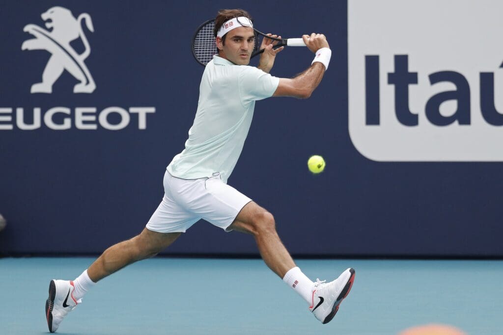 Mar 25, 2019; Miami Gardens, FL, USA; Roger Federer of Switzerland hits a backhand against Filip Krajinovic of Serbia (not pictured) in the third round of the Miami Open at Miami Open Tennis Complex.