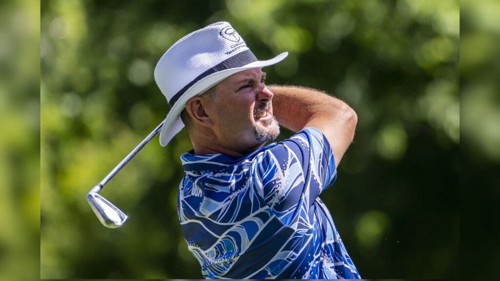Jul 29, 2022; Detroit, Michigan, USA; Rory Sabbatini hits his tee shot on the par 3 ninth hole during the second round of the Rocket Mortgage Classic golf tournament.