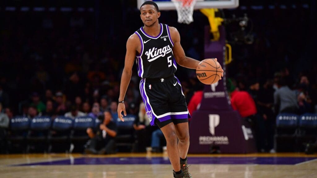 Mar 6, 2024; Los Angeles, California, USA; Sacramento Kings guard De’Aaron Fox (5) controls the ball against the against the Los Angeles Lakers during the first half at Crypto.com Arena