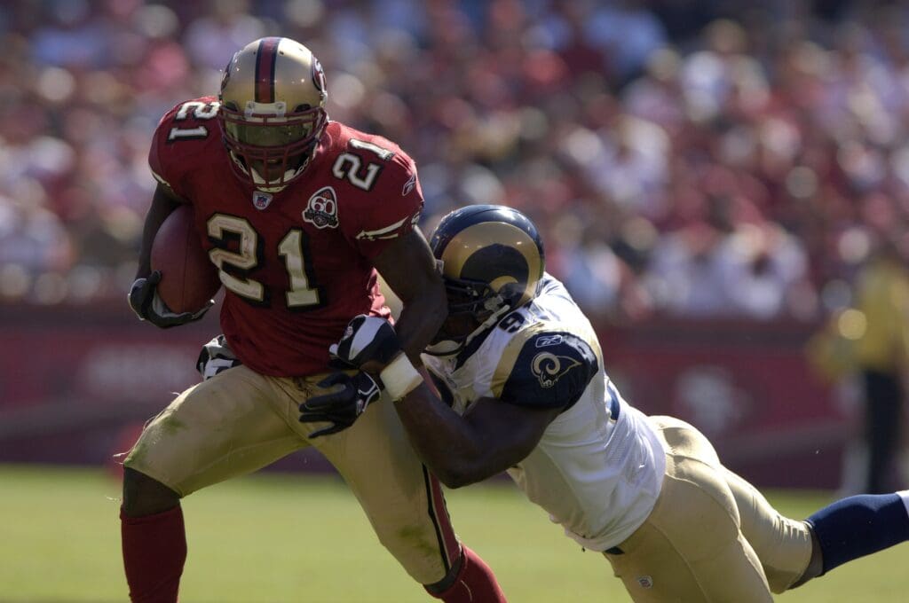 Sep 17, 2006 San Francisco, CA, USA: San Francisco 49ers running back (21) Frank Gore is tackled by St. Louis Rams defensive end (91) Leonard Little during the 3rd quarter at Monster Park in San Francisco, CA. 