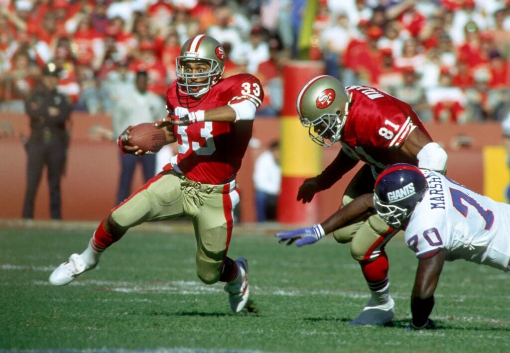 Jan 20, 1991; San Francisco, CA, USA; FILE PHOTO, San Francisco 49ers running back (33) Roger Craig follows the block of (81) Jamie Williams against New York Giants defensive tackle (70) Leonard Marshall at Candlestick Park during the 1990 NFC Championship Game. The Giants defeated the 49ers 15-13.