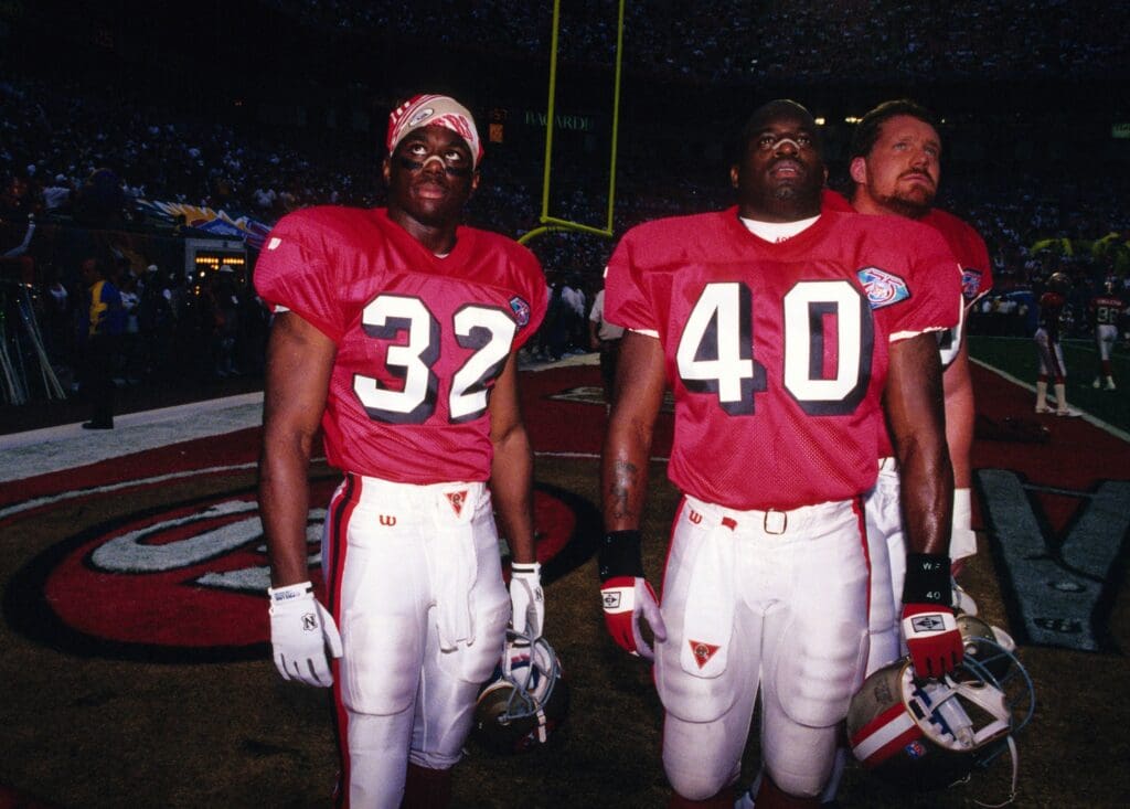 Caption:
Jan 29, 1995; Miami, FL, USA; FILE PHOTO; San Francisco 49ers running back Ricky Watters (32) and running back William Floyd (40) on the field prior to Super Bowl XXIX against the San Diego Chargers at Joe Robbie Stadium. The 49ers defeated the Chargers 49-26.