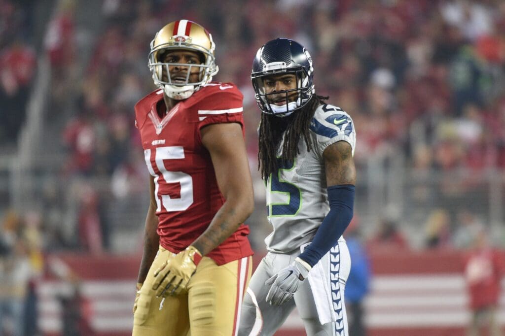 November 27, 2014; Santa Clara, CA, USA; Seattle Seahawks cornerback Richard Sherman (25) looks at San Francisco 49ers wide receiver Michael Crabtree (15) during the third quarter at Levi's Stadium. The Seahawks defeated the 49ers 19-3.