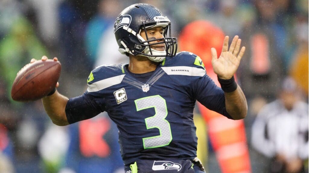 Nov 17, 2013; Seattle, WA, USA; Seattle Seahawks quarterback Russell Wilson (3) passes against the Minnesota Vikings during the second half at CenturyLink Field.