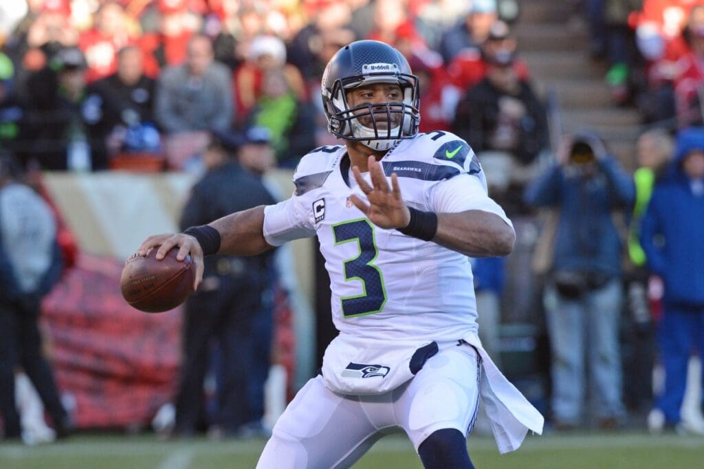 December 8, 2013; San Francisco, CA, USA; Seattle Seahawks quarterback Russell Wilson (3) passes the football during the third quarter against the San Francisco 49ers at Candlestick Park. The 49ers defeated the Seahawks 19-17.