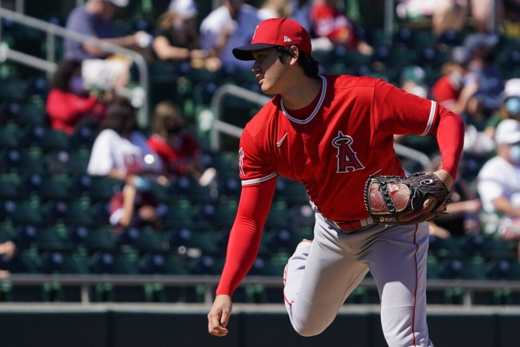 Mar 5, 2021; Mesa, Arizona, USA; Los Angeles Angels pitcher Shohei Ohtani (17) throws against the Oakland Athletics during a spring training game at Hohokam Stadium.