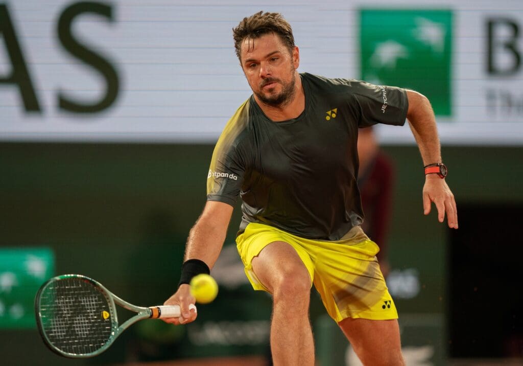 May 26, 2024; Paris, France; Stan Wawrinka of Switzerland returns a shot during his match against Andy Murray of Great Britain on day one of Roland Garros at Stade Roland Garros. Mandatory Credit: Susan Mullane-USA TODAY Sports