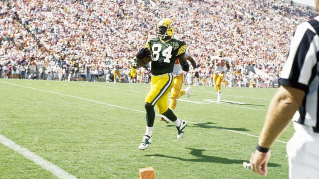Oct 24, 1993; Tampa, FL, USA; Green Bay Packers receiver Sterling Sharpe (84) scores a touchdown against the Tampa Bay Buccaneers at Tampa Stadium. FILE PHOTO;