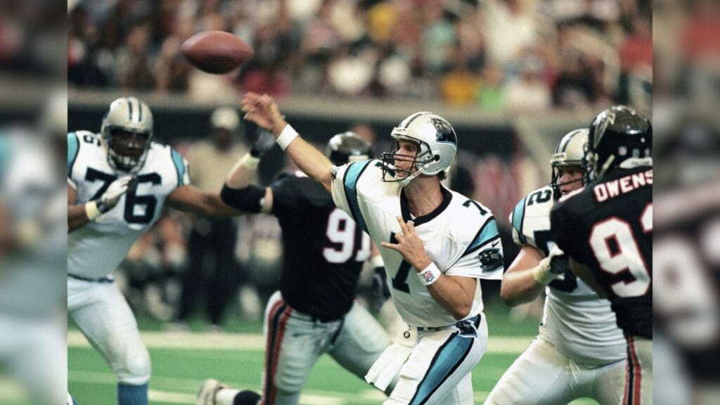 Sep 7, 1997; Atlanta, GA, USA; FILE PHOTO; Carolina Panthers quarterback Steve Beuerlein (7) throws the ball against the Atlanta Falcons during the 1997 season at the Georgia Dome.