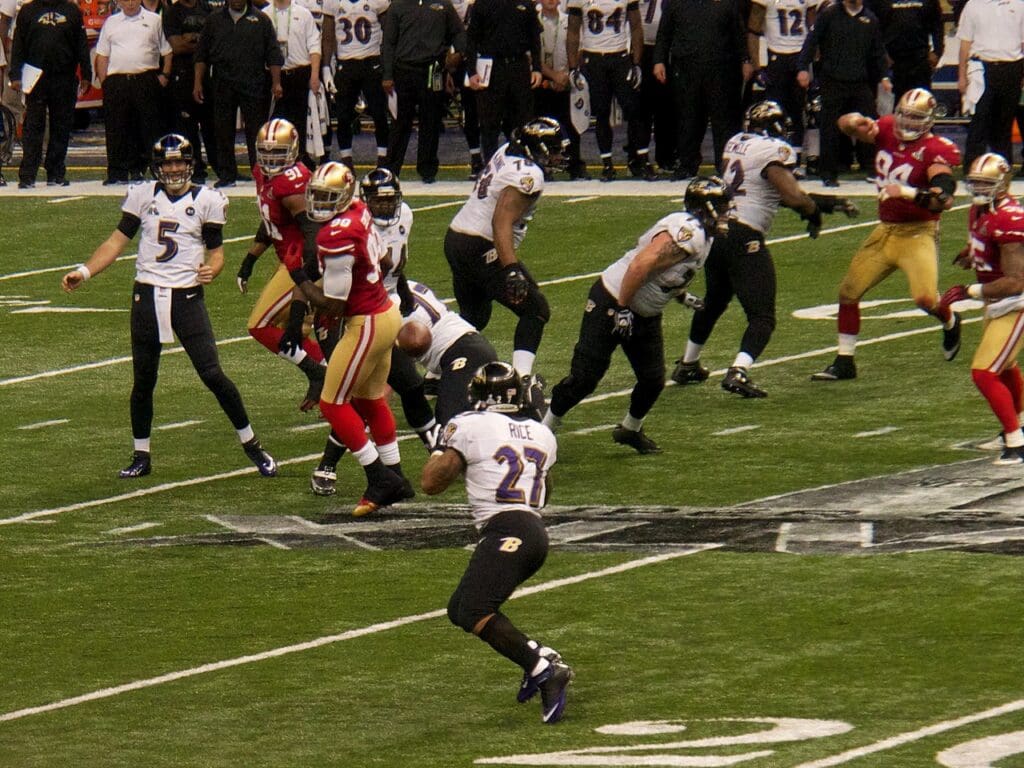 Joe Flacco (#5) quarterback for the Baltimore Ravens passes to teammate Ray Rice during Super Bowl XLVII against the San Francisco 49ers in 2013.