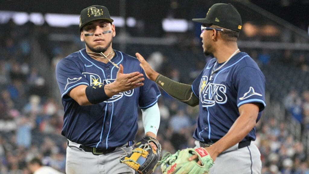 May 17, 2024; Toronto, Ontario, CAN; Tampa Bay Rays third baseman Isaac Paredes (17, left) is greeted by second baseman Richie Palacios (1) after starting a double play against the Toronto Blue Jays in the eighth inning at Rogers Centre.