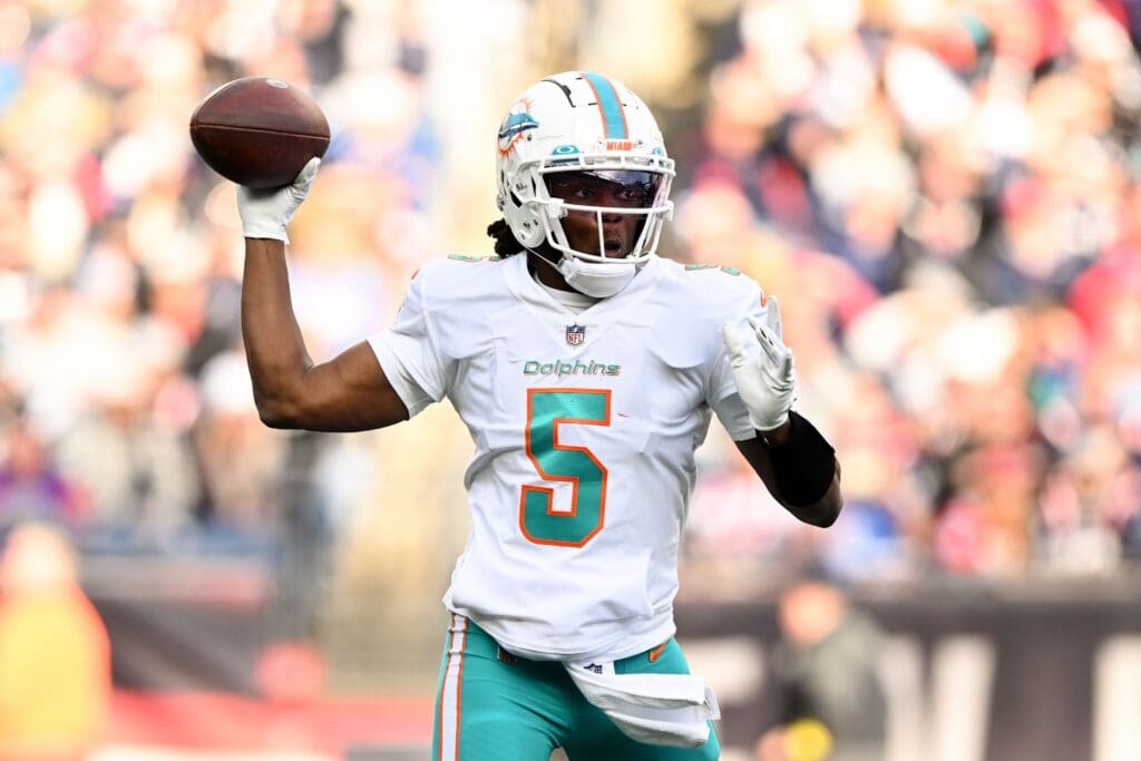 Jan 1, 2023; Foxborough, Massachusetts, USA; Miami Dolphins quarterback Teddy Bridgewater (5) throws the ball against the New England Patriots during the first half at Gillette Stadium. Mandatory Credit: Brian Fluharty-USA TODAY Sports