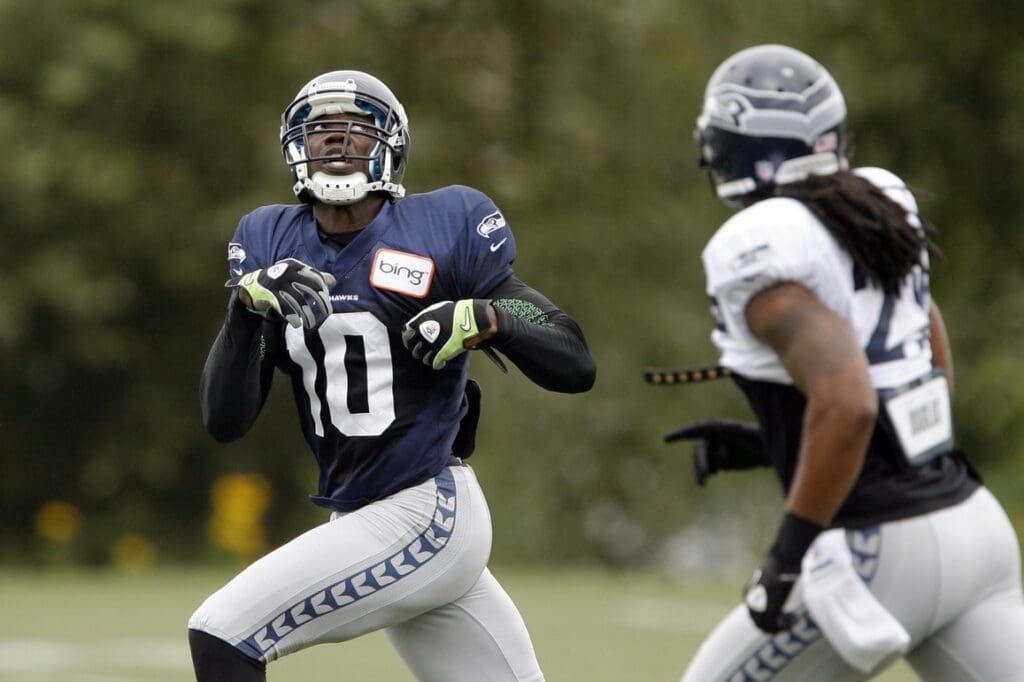Aug 8, 2012; Renton, WA, USA; NFL: Seattle Seahawks wide receiver Terrell Owens (10) looks up to catch a pass during training camp practice at the Virginia Mason Athletic Center