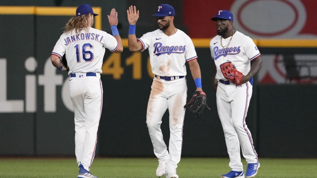 Jun 14, 2023; Arlington, Texas, USA; Texas Rangers left fielder Travis Jankowski (16) celebrates with first baseman Ezequiel Duran (middle) and right fielder Adolis Garcia (right) their team s 6-3 win over the Los Angeles Angels following the ninth inning at Globe Life Field