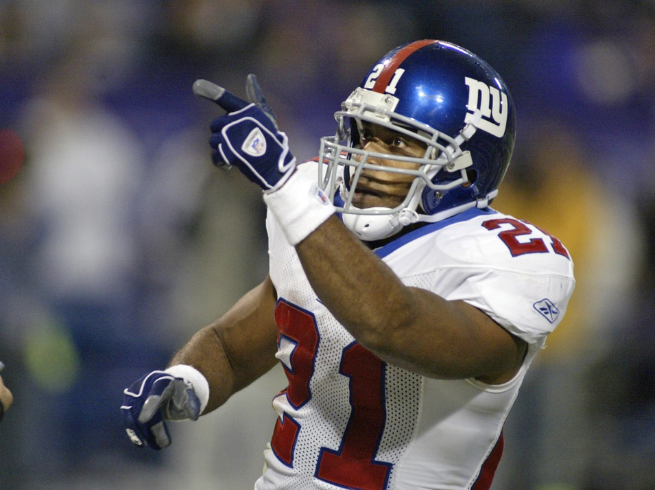 Oct 31, 2004; Minneapolis, MN, USA; New York Giants running back #21 Tiki Barber celebrates his second touchdown against the Minnesota Vikings in the second quarter at the Humphrey Metrodome. Giants lead at the half 20-0.